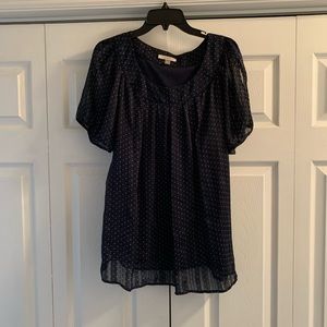 Navy polka dot blouse with slits in the sleeves